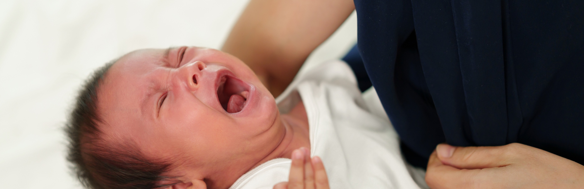 breastfeeding baby fusses at breast; breast refusal; breast aversion; baby won't latch