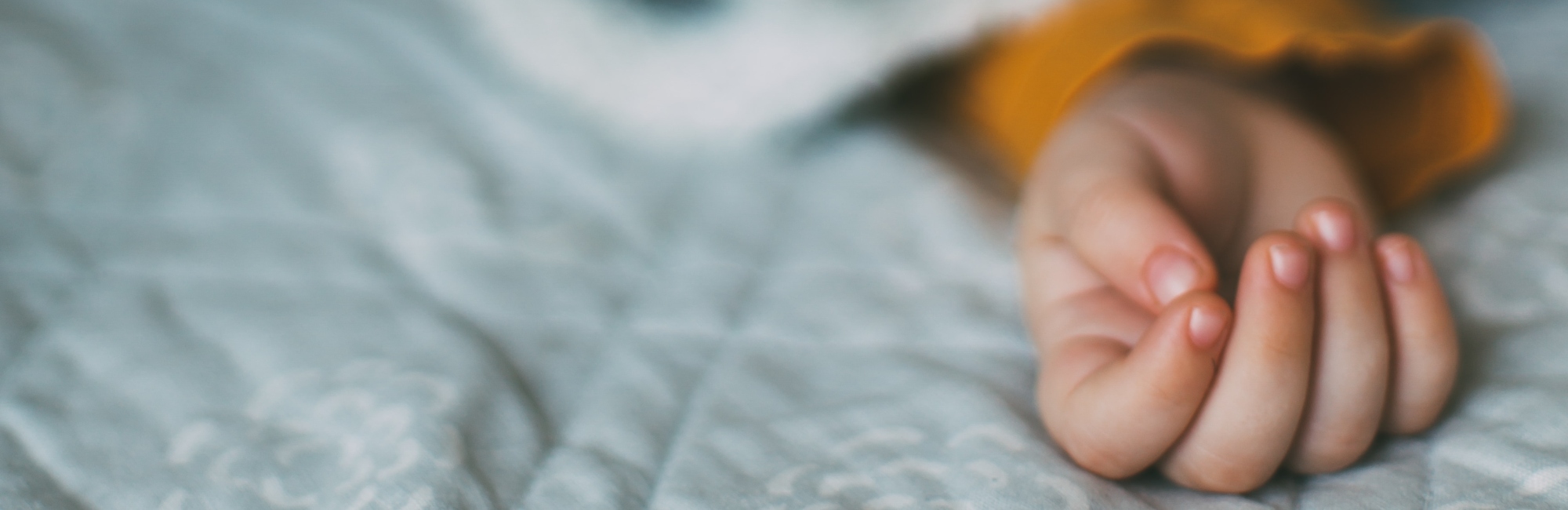 toddler's hand and arm