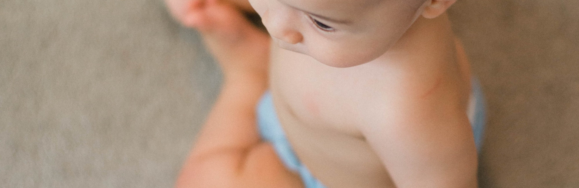 baby sitting up on floor