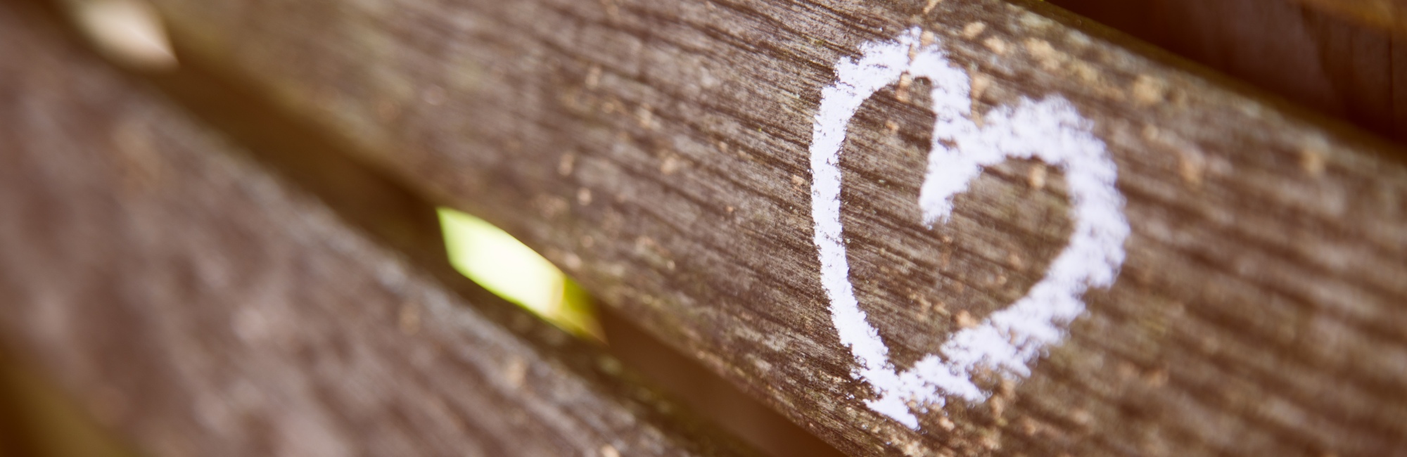 white love heart painted onto wooden beam