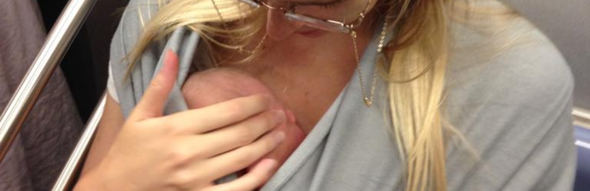 mother carries baby wrapped in sling close to her body