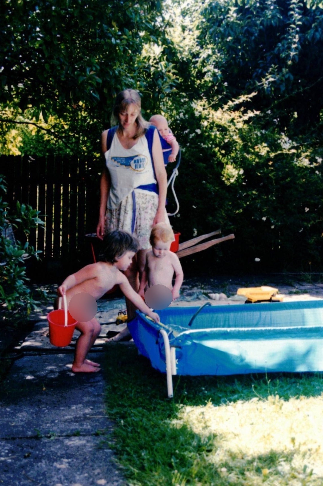 Pam carrying Tom while other children play