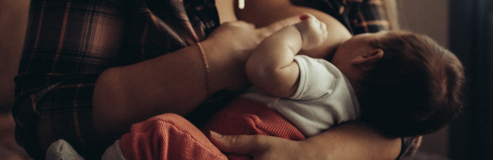 baby being breastfed during the night