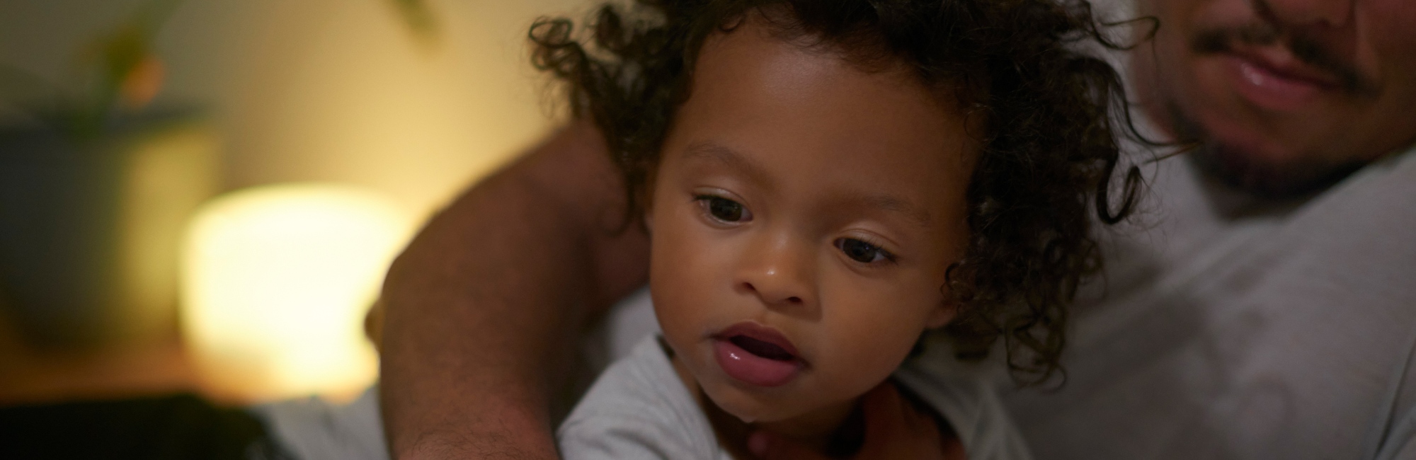 dad plays with toddler